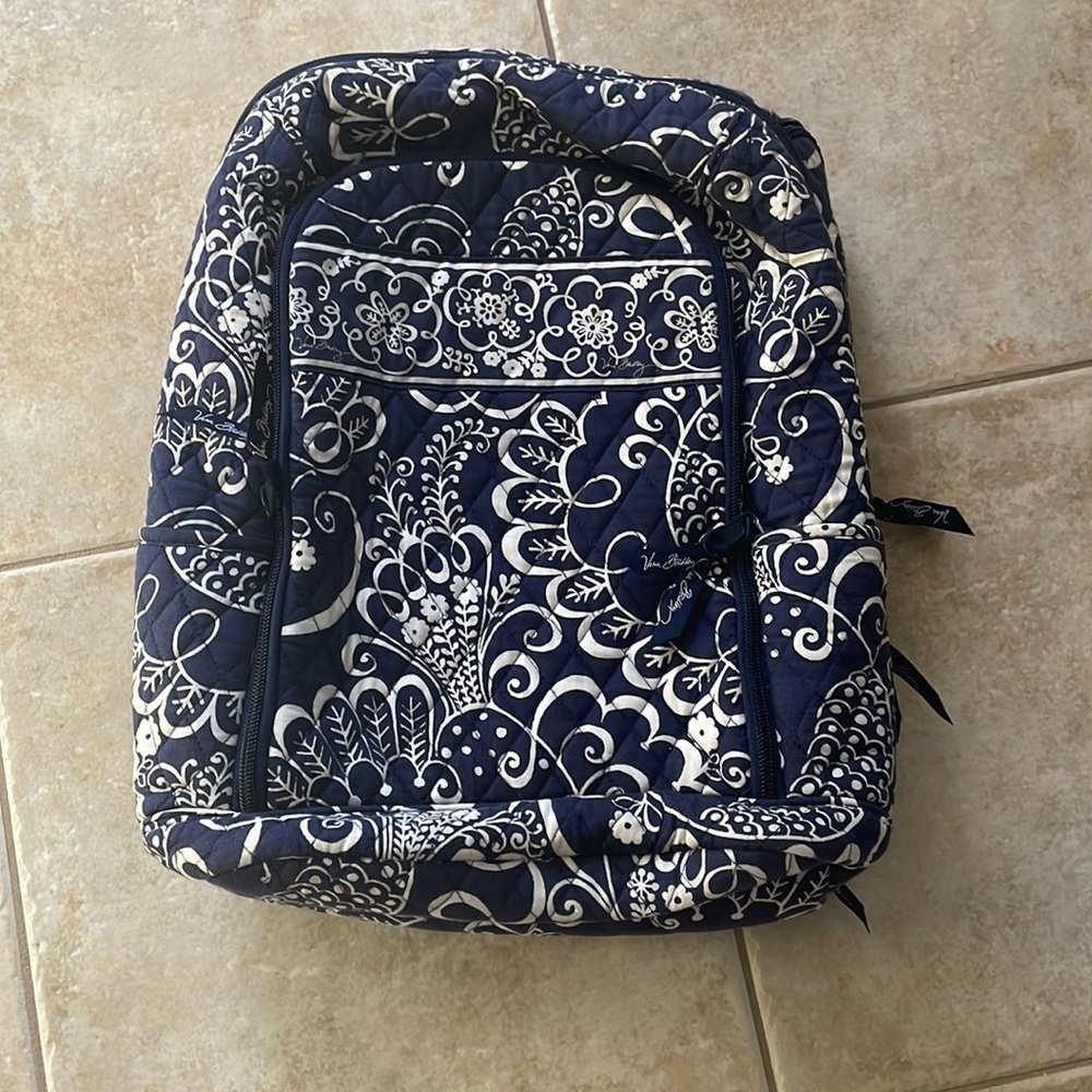 Vera Bradley laptop backpack with adjustable straps and suitcase strap